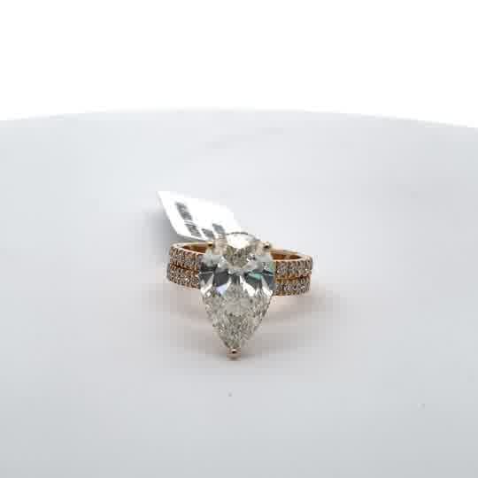 Yellow Gold Ring Featuring a Pear Cut Diamond