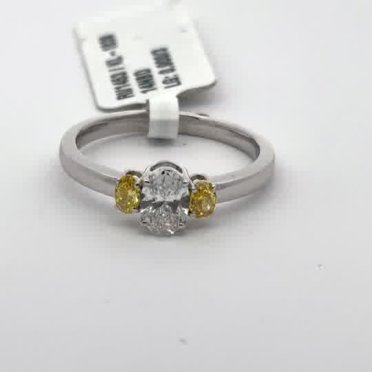 White Gold Multistone Ring with Oval Cut Diamond