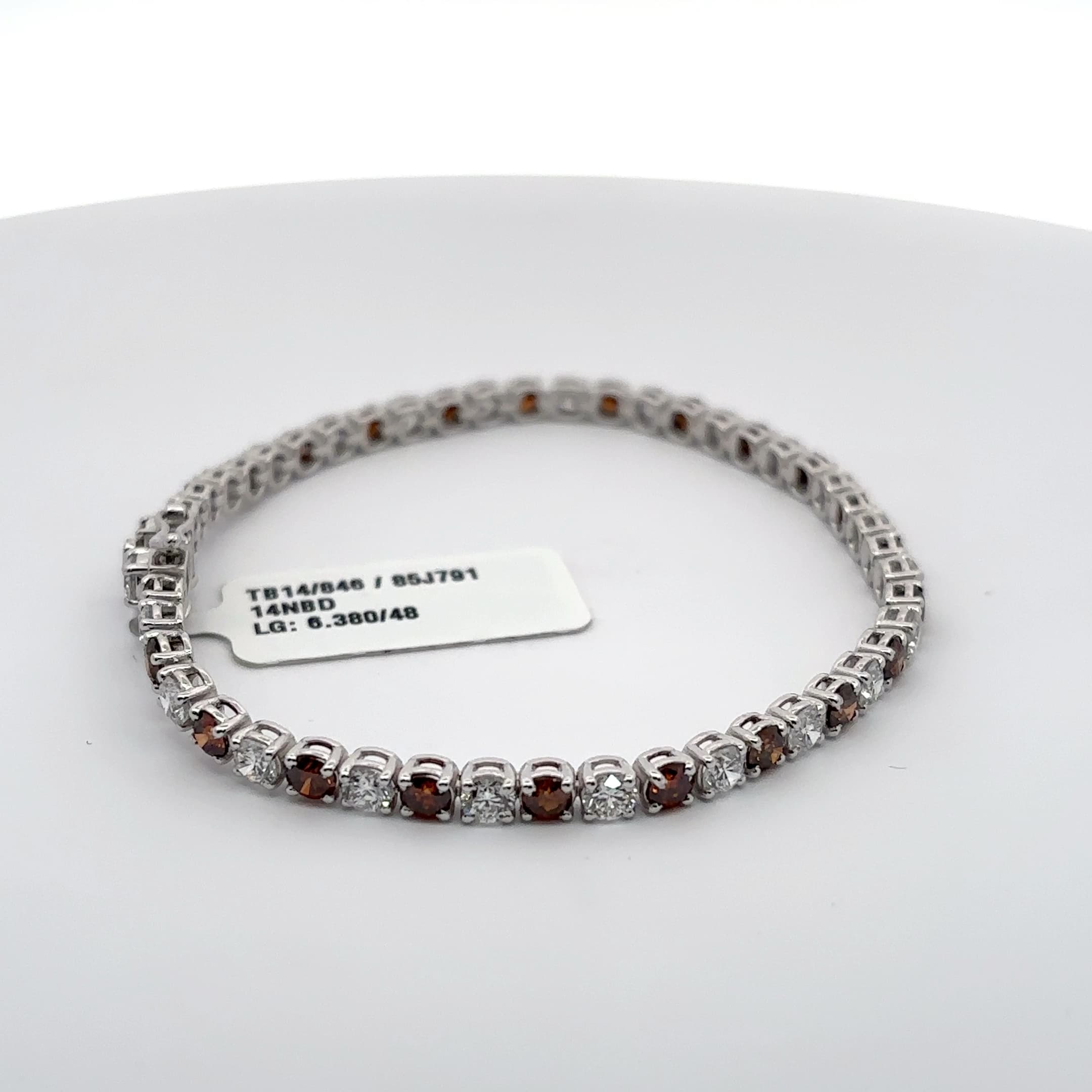 White Gold Tennis Bracelet with Reddish Orange and white rounds 5