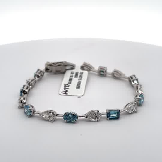 Tennis Bracelet with blue aquamarine mix fancy shapes and white pear Cut Diamonds