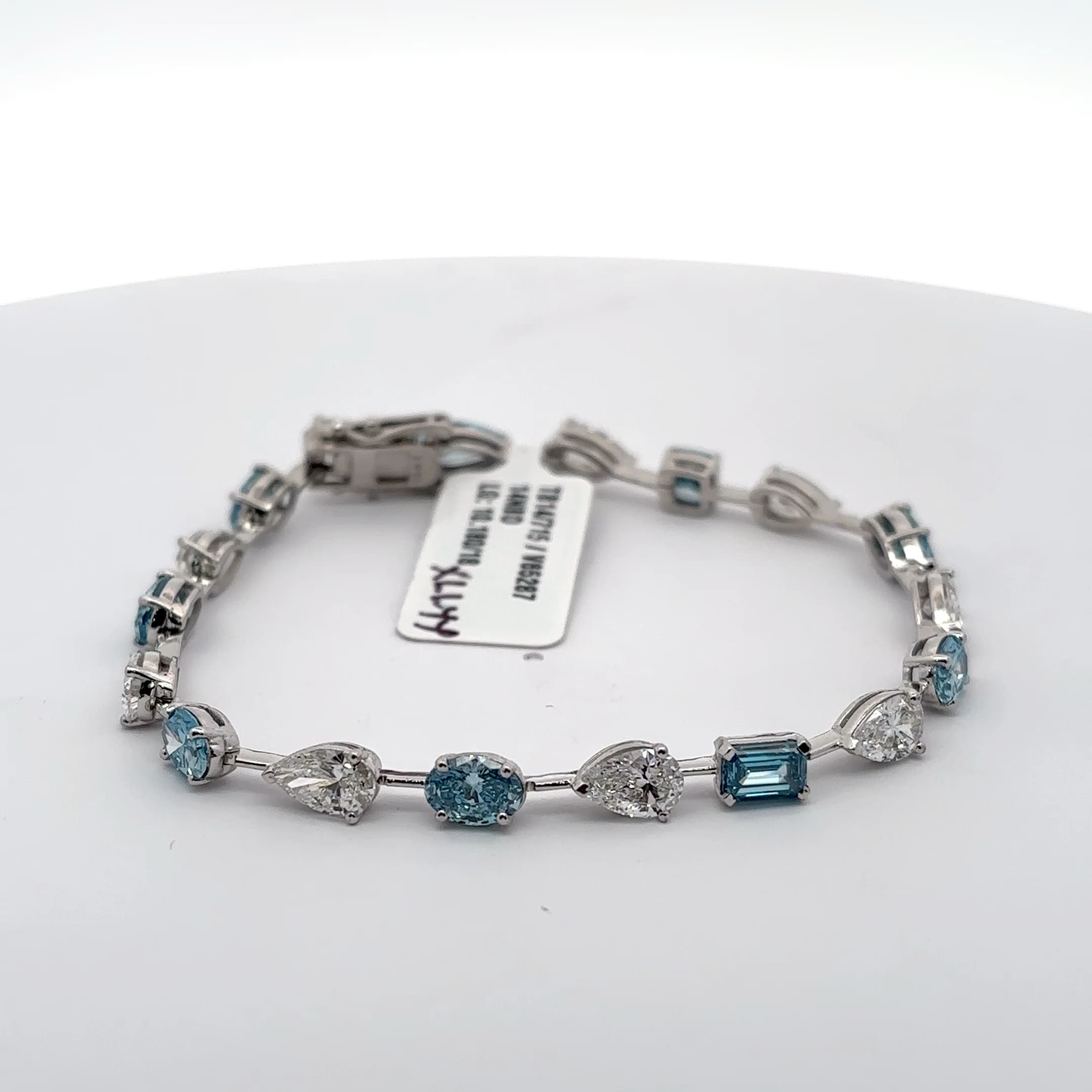 Tennis Bracelet with blue aquamarine mix fancy shapes and white pear Cut Diamonds 2