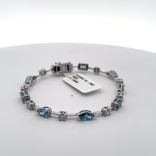 White Gold Tennis Bracelet with blue aquamarine colour in fancy shapes with rounds