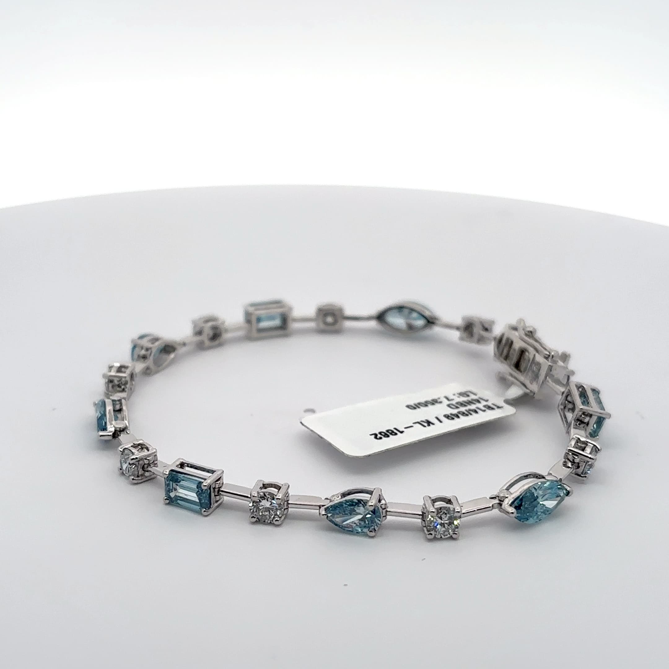 White Gold Tennis Bracelet with blue aquamarine colour in fancy shapes with rounds 3