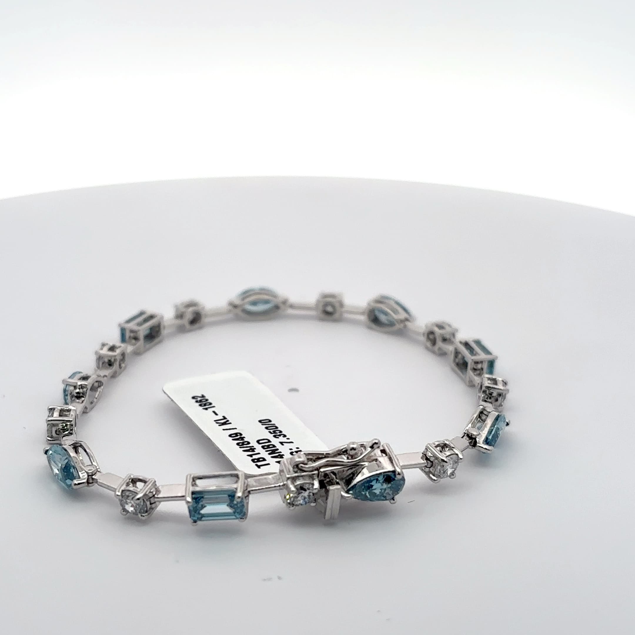 White Gold Tennis Bracelet with blue aquamarine colour in fancy shapes with rounds 4