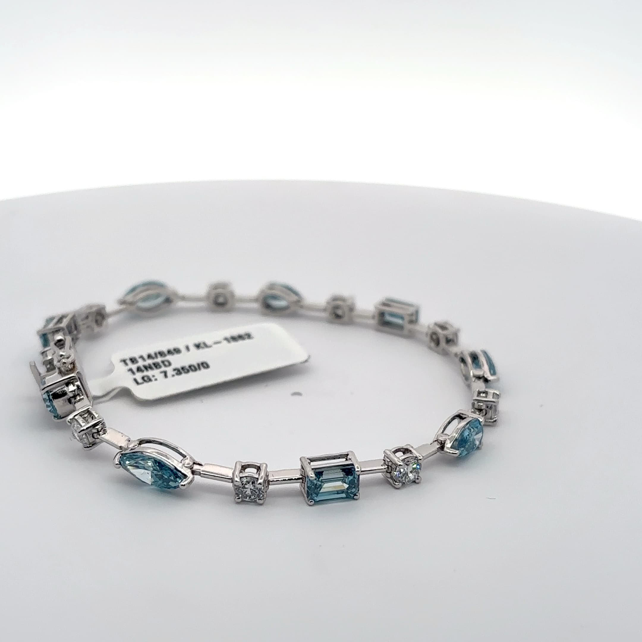 White Gold Tennis Bracelet with blue aquamarine colour in fancy shapes with rounds 5