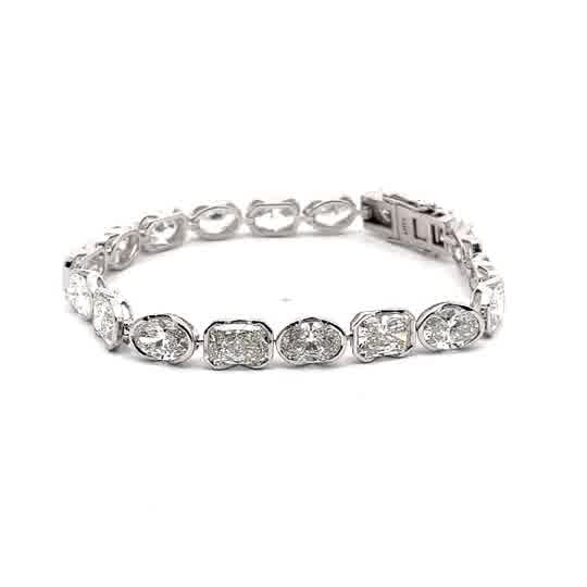 White Gold Tennis Bracelet with Oval and Radint Cut Diamonds in half bezel set