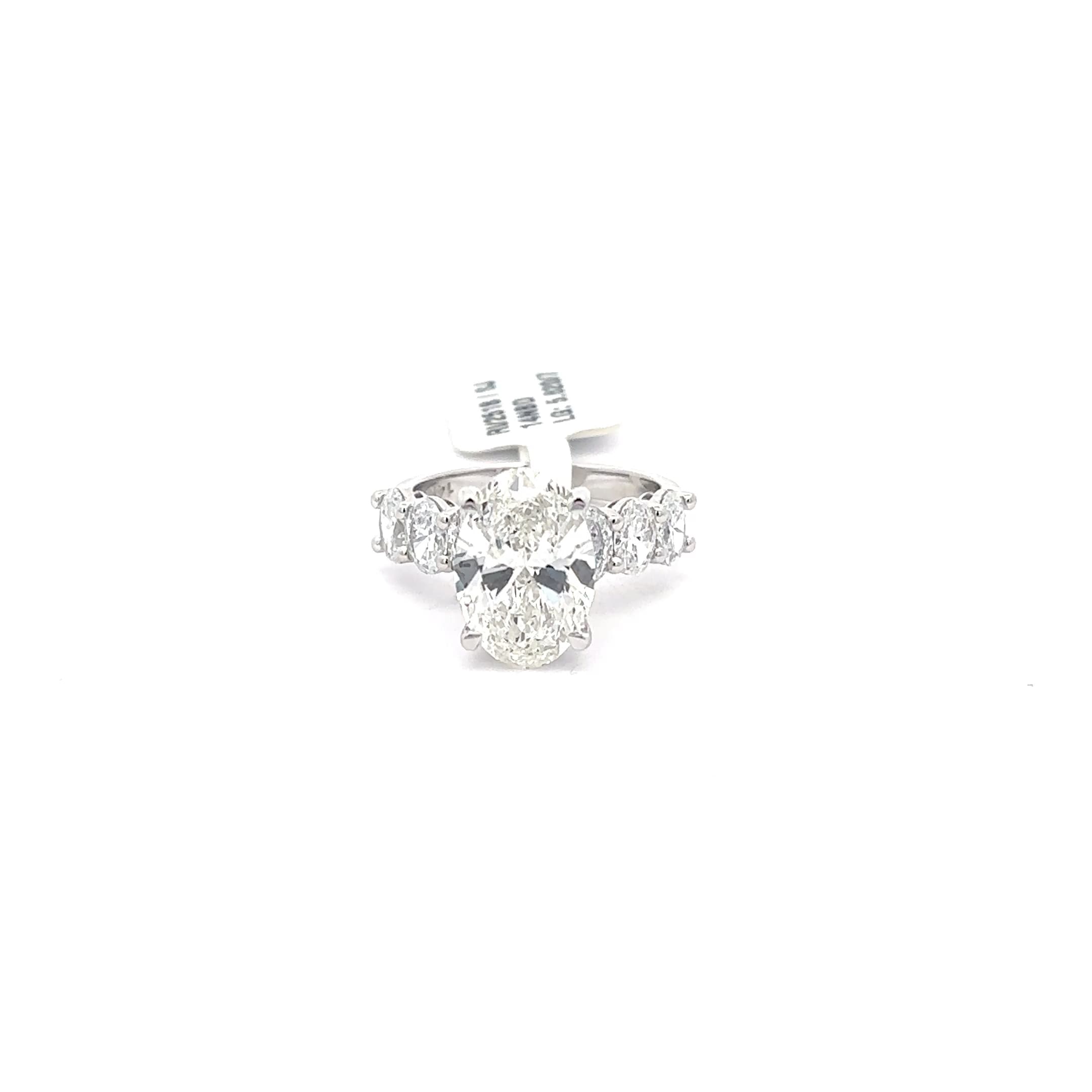 Multistone Ring with Oval Cut Diamond. :62cts 2