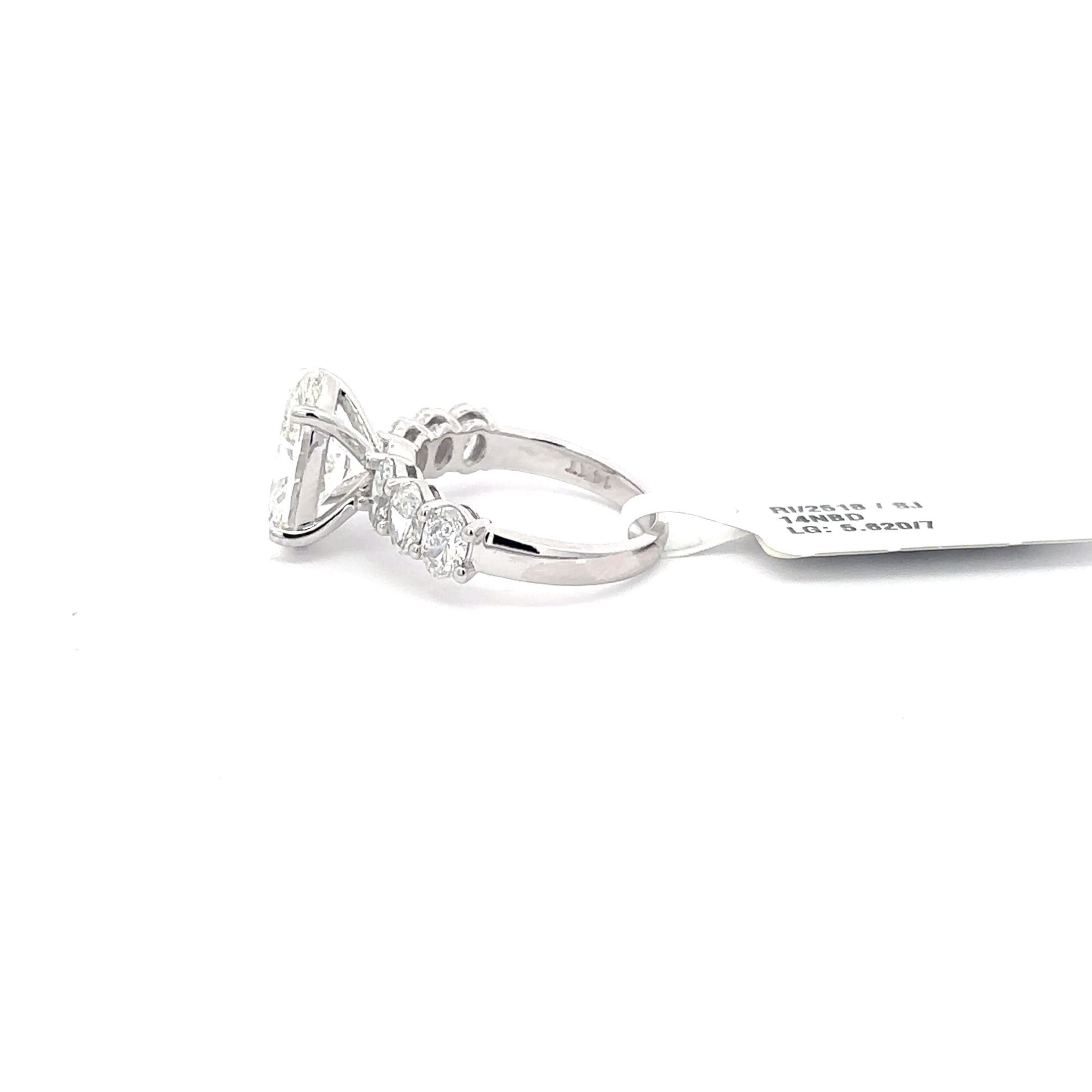 Multistone Ring with Oval Cut Diamond. :62cts 3