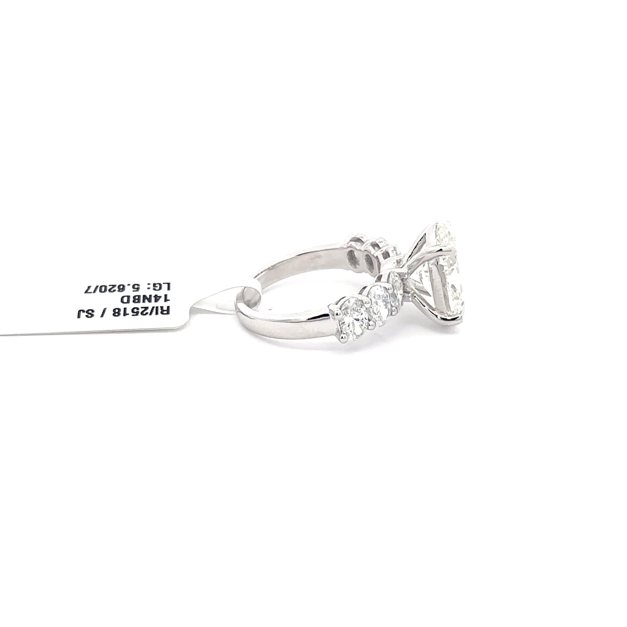 Multistone Ring with Oval Cut Diamond. :62cts 5