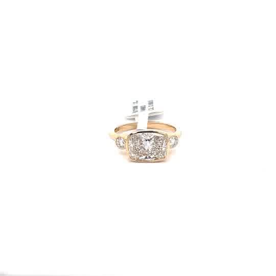 Cushion Cut Diamond Three-Stone Ring in Yellow Gold