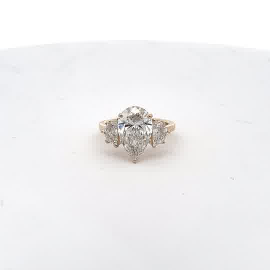Yellow Gold Three-Stone Ring with Pear-Shaped Diamond
