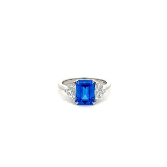 Emerald-Cut Blue Topaz Three-Stone Ring in White Gold