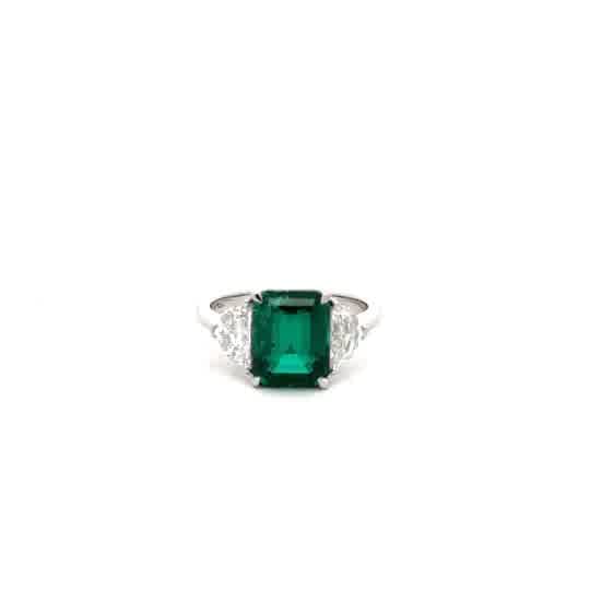 Emerald Cut Emerald Three-Stone Ring in White Gold