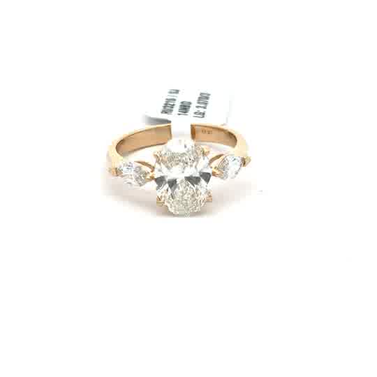Oval Diamond Three-Stone Ring in Yellow Gold
