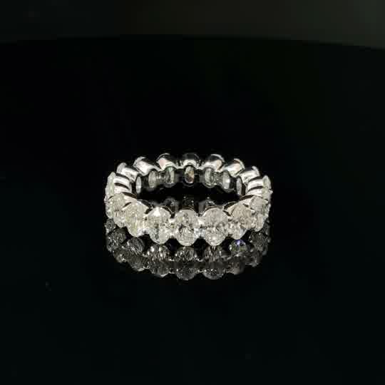 Oval Cut Diamond Eternity Ring in White Gold Pang setting