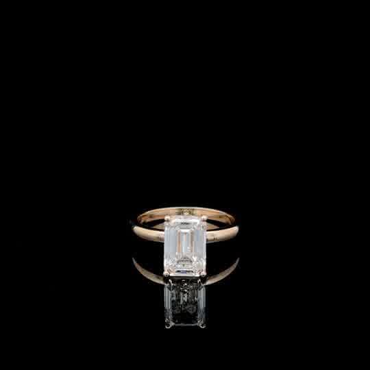 Emerald Cut Diamond Solitaire Ring in Yellow Gold