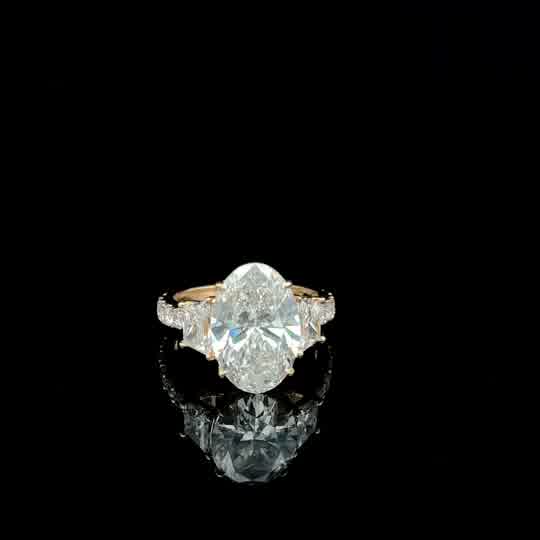 Oval Diamond Three-Stone Ring in Yellow Gold