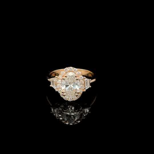 Oval Diamond Halo Engagement Ring in Yellow Gold