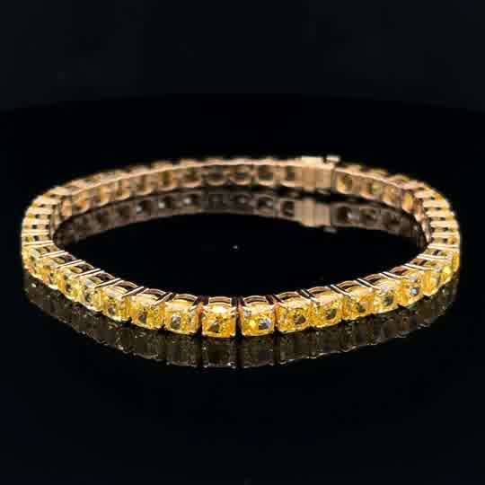 Fancy Vivid Yellow Diamond Tennis Bracelet in Yellow Gold