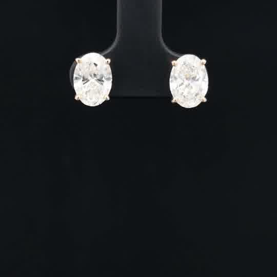 Oval Cut Diamond Stud Earrings in Yellow Gold