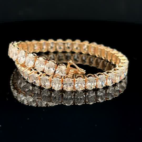 Oval Cut Diamond Tennis Bracelet — Yellow Gold