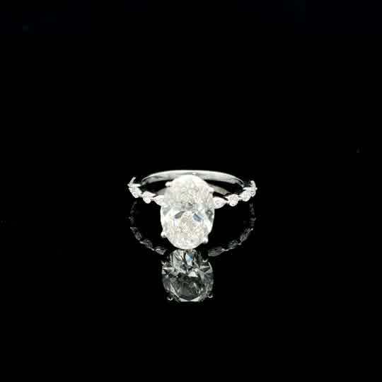 Oval Diamond Solitaire Ring with Accented White Gold Band