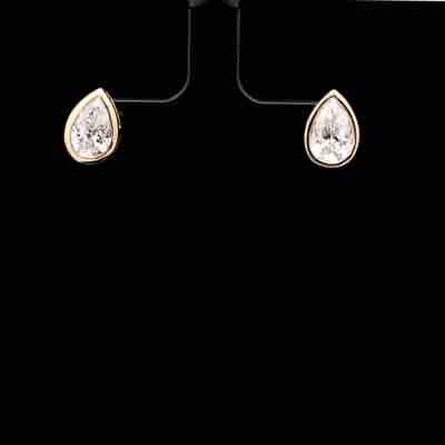 Pear Cut Diamond Bezel Stud Earrings in Yellow Gold